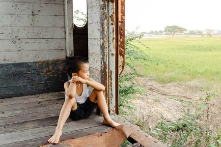 The lonely boy the old train room looking to outsideの写真素材