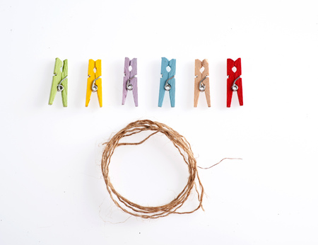 Several color of wood clip and rope on white backgroundの写真素材