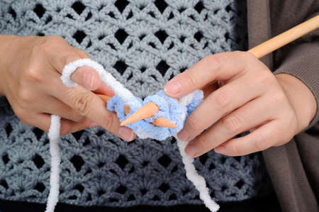 Woman hand use wood knit for wool hand work
