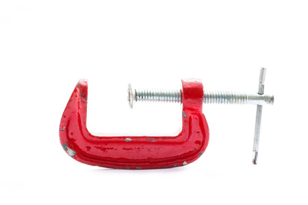 Grunge old close up Red c-clamp on white backgroundの写真素材