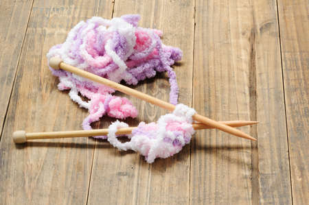 Close up knit wool on grunge wood table background