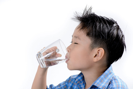 Young asian boy take medicine and drink water . Heath and hospital conceptの写真素材