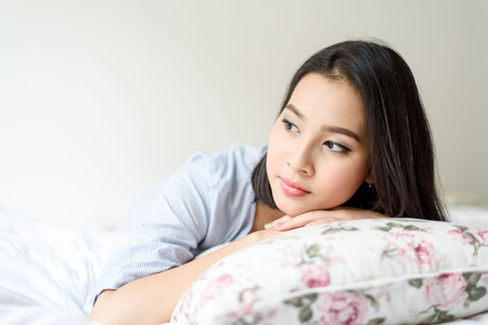 Girl on the bedの写真素材