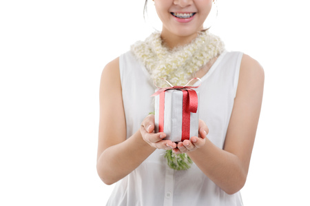 Young girl carry gift box in his hand. Christmas and new year concept.