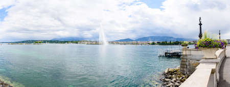 Panorama of fountain in Geneva or Leman lake with blue sky white cloudの写真素材