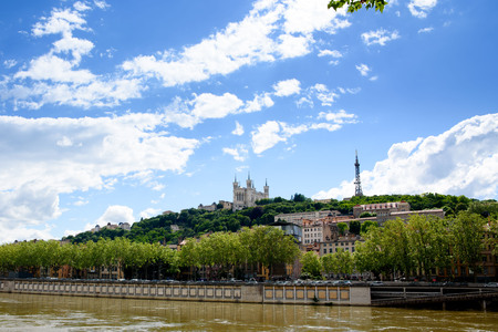 Soane river view with cathedrals Saint-Georges and Fourviere under blue sky white cloud in Lyon, France.の写真素材