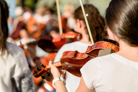 Selective focus at the violin play by kids.の写真素材