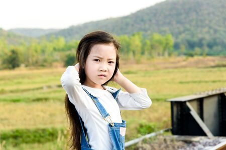 Young asian Thai girl, walking on the railway on the forest backgroundの写真素材