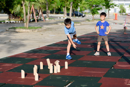 Young asian boy play with wooden toy and number togetherの写真素材