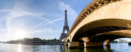 Low angle from the bridge in front of Eiffel tower, Paris, France.の写真素材