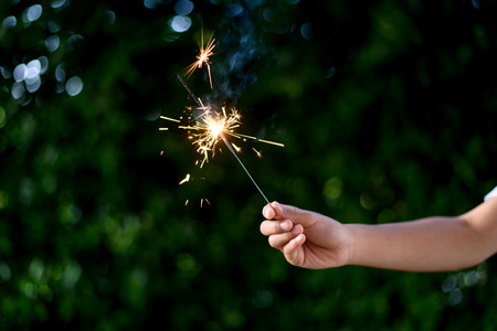 Beautiful little candle fireworks in glass bottle.の写真素材