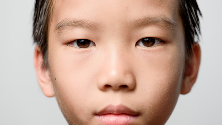 Close up at Young Asian boy brown eyeの写真素材