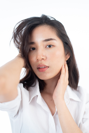 Portrait of young Asian Thai woman in an on white background.の写真素材