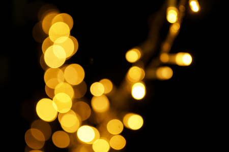 Out focus of light bulb celebrating party with random beat in a black backgroud