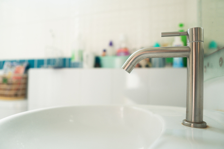 Close up modern faucet in bathroomの写真素材