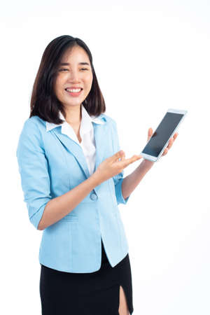 Young business Thai woman use a tablet phone to presentation on white background.の写真素材