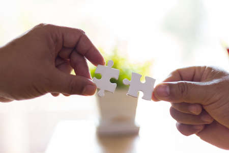 business people assembling jigsaw puzzle, Teamwork conceptの写真素材