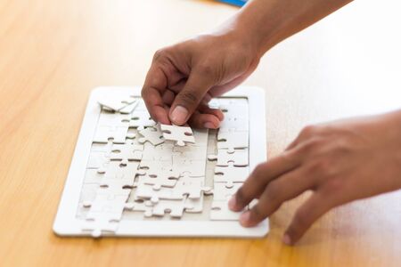business people assembling jigsaw puzzle, Teamwork conceptの写真素材