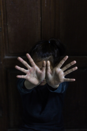 Women protect themselves by hand, stop hurting women.の写真素材