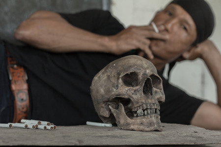 man smoking a cigarette.Concept of smoking deadly.Stop Smoking Concept.の写真素材