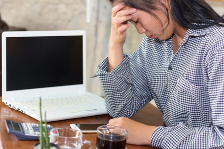 businesswoman tired from work And headaches in the coffee shopの写真素材