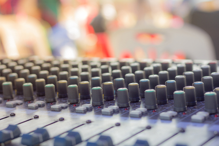 buttons equipment for sound mixer control,selective focus, blurry backgroundの写真素材