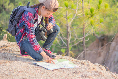 Female hikers see a map of nature trails.の写真素材