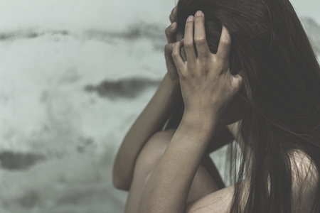 Young women are stressed because of being trafficked to sex workers, anti-trafficking and stopping violence against women, International Women's Dayの写真素材