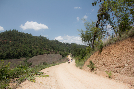 Enduro tourists on a dusty dirt road ,Enduro Extreme Motocross MX rider.の写真素材