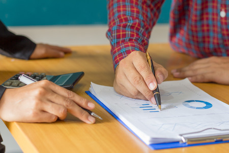 Businessman hands analyzing financial statistics. Analysis of financial reports. の写真素材