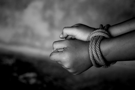 Kidnapped boy tied with rope. stop abusing violence.concept for kidnapping, violence, terrified,  Human Rightsの写真素材