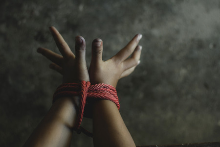 Kidnapped boy tied with rope. stop abusing violence.concept for kidnapping, violence, terrified,  Human Rightsの写真素材