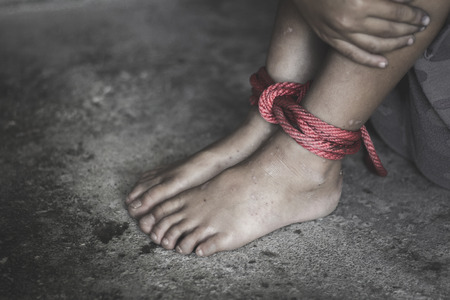 Kidnapped boy tied with rope. stop abusing violence.concept for kidnapping, violence, terrified,  Human Rightsの写真素材