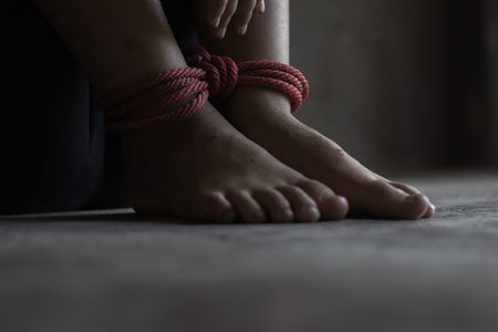 Kidnapped boy tied with rope. stop abusing violence.concept for kidnapping, violence, terrified,  Human Rightsの写真素材
