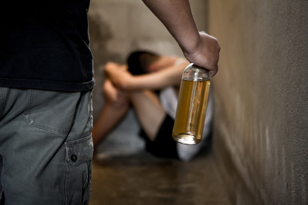Drunken men are attacking children in the corner, Stop violence in children Help prevent abuse and bring him back to family ,Fathers alcoholism.の写真素材