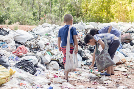 Poor children collect garbage for sale,, the concept of pollution and the environment,Recycling old rubbish,World Environment Dayの写真素材
