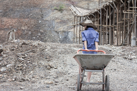 Mature forced children to work because of poverty. Violence children and trafficking concept,Anti-child labor, Rights Day on December 10.の写真素材