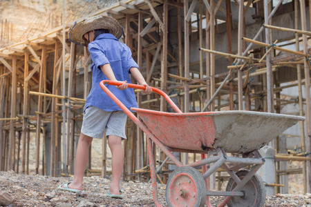 Children work construction because of poverty. Violence children and trafficking concept,Anti-child labor, Rights Day on December 10.の写真素材