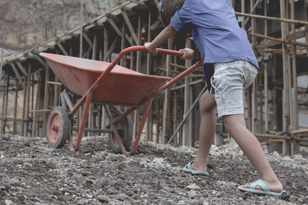 Children work construction because of poverty. Violence children and trafficking concept,Anti-child labor, Rights Day on December 10.の写真素材
