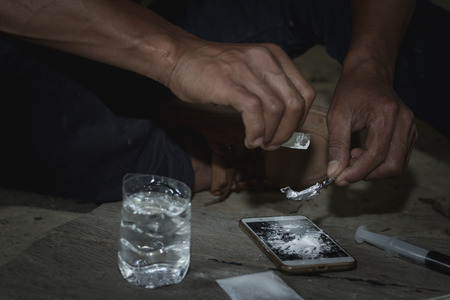 Men are taking heroin. Law and police concept.26 June, International Day Against Drug Abuse and Illicit Traffickingの写真素材