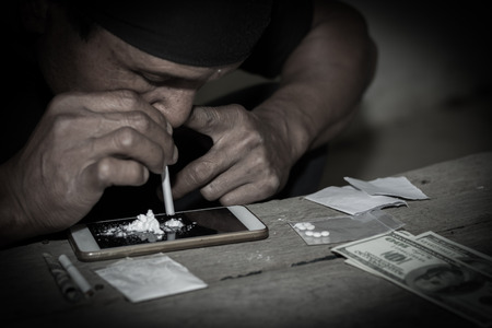 Men use overdose drugs. Law and police concept.26 June, International Day Against Drug Abuse and Illicit Traffickingの写真素材