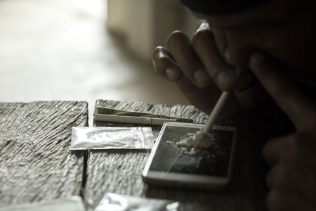 Men use overdose drugs. Law and police concept.26 June, International Day Against Drug Abuse and Illicit Traffickingの写真素材