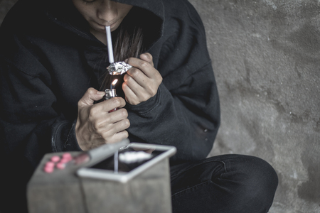 Young woman with drug addiction , The concept of crime and drug addiction. 26 June, International Day Against Drug Abuse and Illicit Traffickingの写真素材