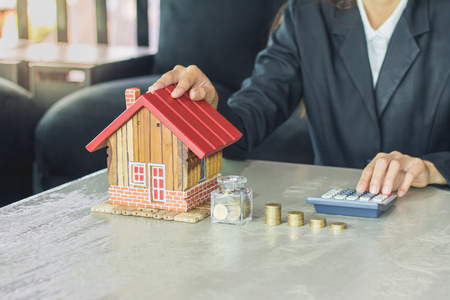 Money coins with home, Saving for buy home conceptの写真素材