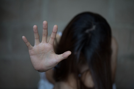 Woman bondage in angle of abandoned building image blur , stop violence against Women, international...