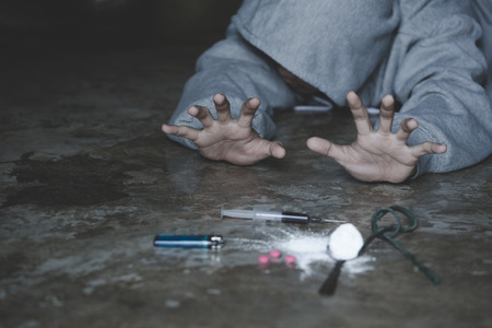 Human hands on dark background, Stop drug addiction concept, Do not interfere with drugs,  International Day against Drug Abuse.の写真素材