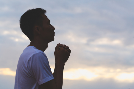 Man hands praying to god, Man Pray for god blessing to wishing have a better life. begging for forgiveness and believe in goodness, Christian Religion concept background.の写真素材