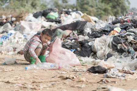 Poor children collect garbage for sale because of poverty, Junk recycle, Child labor, Poverty concept, World Environment Day,の写真素材