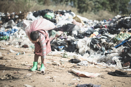 Poor children collect garbage for sale because of poverty, Junk recycle, Child labor, Poverty concept, World Environment Day,の写真素材