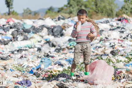 Poor children collect garbage for sale because of poverty, Junk recycle, Child labor, Poverty concept, World Environment Day,の写真素材